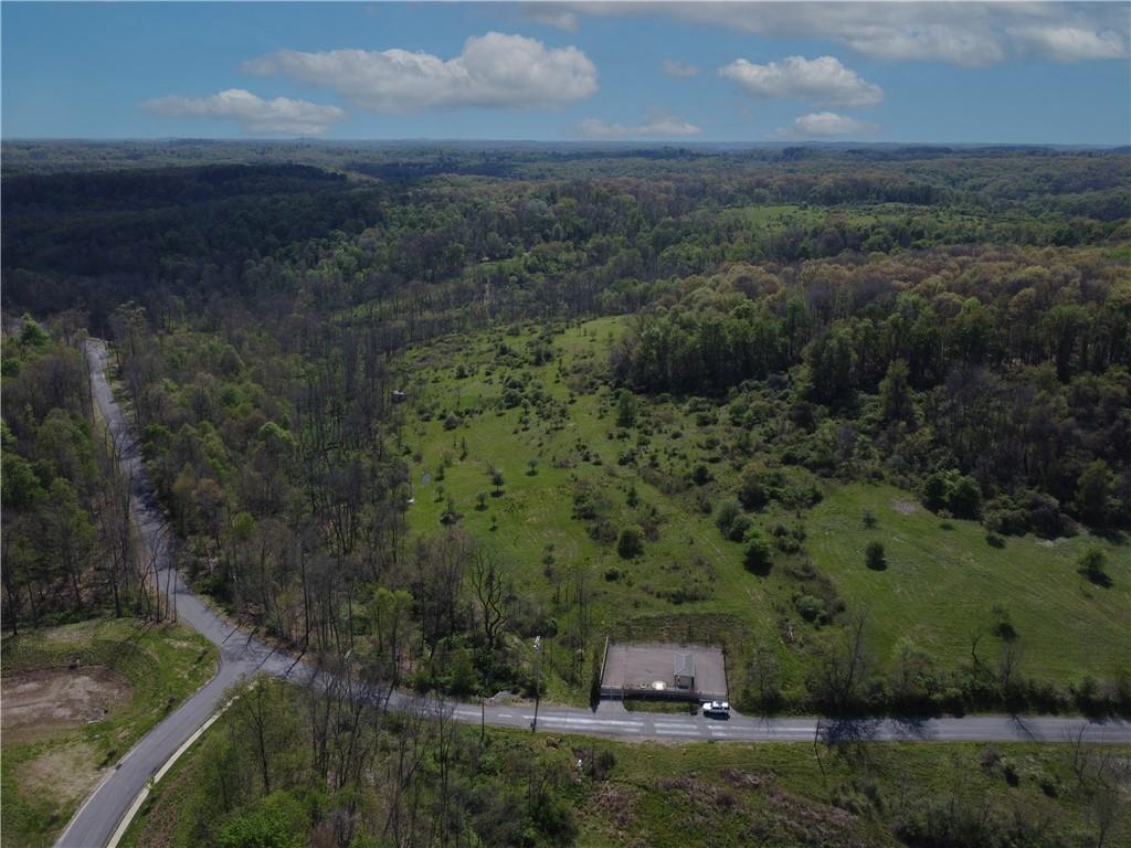 5671 North Montour Road Gibsonia, PA 15044 - Photo 3 of 10 a view of a forest with a street