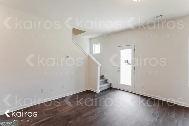 an entryway with wooden floor