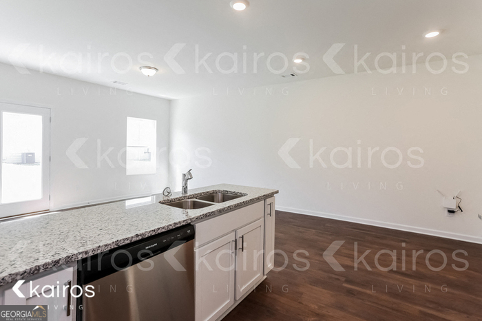 114 Dudley Way Southwest Cartersville, GA 30120 - Photo 5 of 17 a kitchen with a sink and cabinets