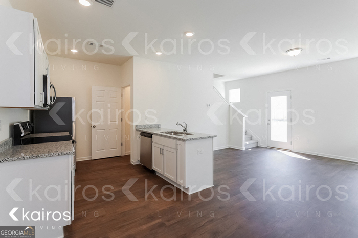 114 Dudley Way Southwest Cartersville, GA 30120 - Photo 6 of 17 a kitchen with a sink appliances and cabinets