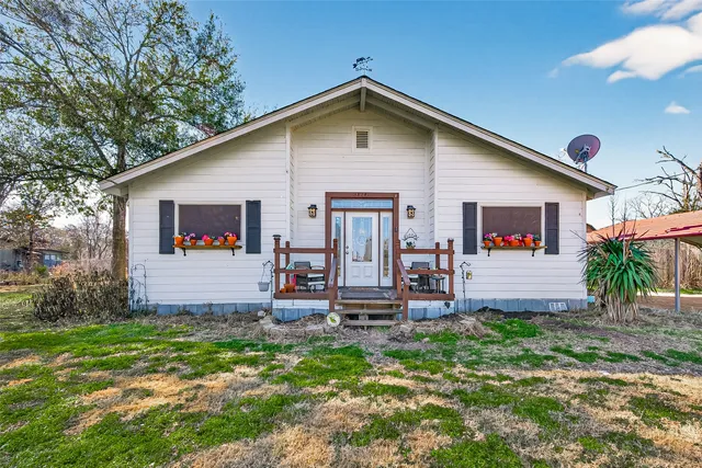 a front view of house with yard and seating area
