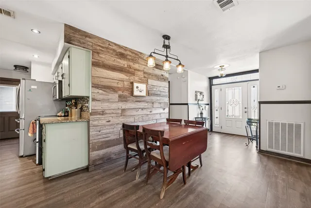 a kitchen with sink cabinets and wooden floor