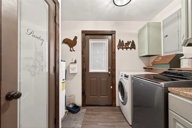 a kitchen with a refrigerator and cabinets