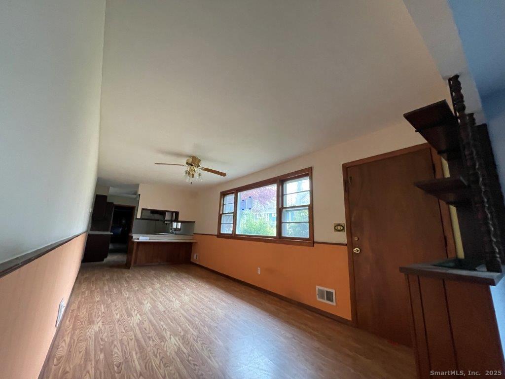 3 Medley Lane Clinton, CT 06413 - Photo 13 of 35 a living room with furniture and a wooden floor