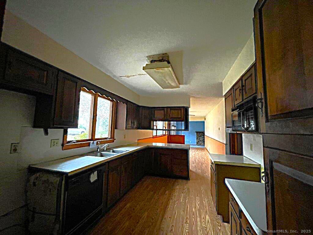 3 Medley Lane Clinton, CT 06413 - Photo 14 of 35 a kitchen with stainless steel appliances sink stove microwave and cabinets