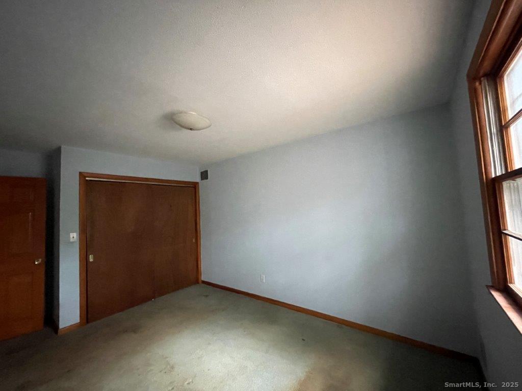3 Medley Lane Clinton, CT 06413 - Photo 22 of 35 an empty room with windows and entrance