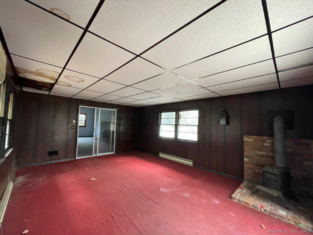 3 Medley Lane Clinton, CT 06413 - Photo 26 of 35 a view of empty room with window and fireplace