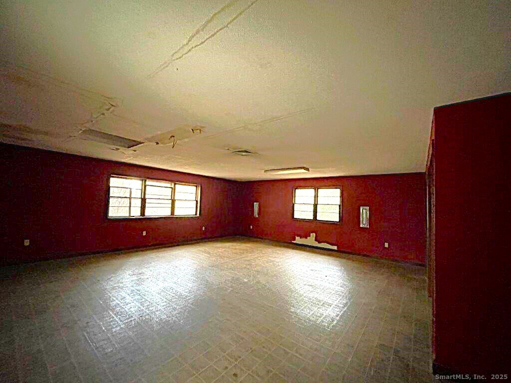 3 Medley Lane Clinton, CT 06413 - Photo 27 of 35 a view of a room with wooden floor and a window
