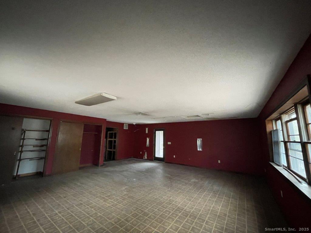 3 Medley Lane Clinton, CT 06413 - Photo 28 of 35 an empty room with furniture and window