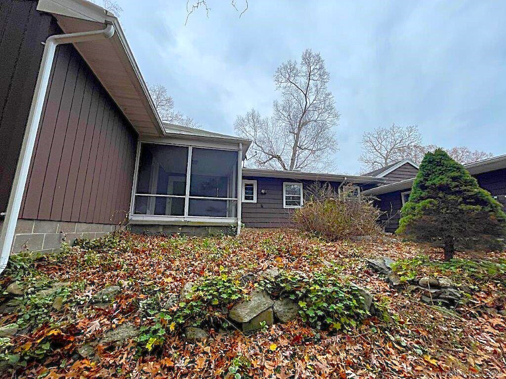 3 Medley Lane Clinton, CT 06413 - Photo 5 of 35 a front view of a house with a garden
