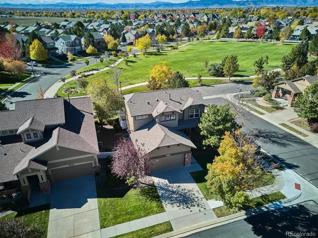 an aerial view of a house with a yard swimming pool outdoor seating and yard
