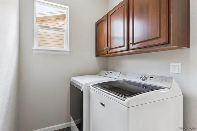 a bathroom with a tub a sink and a mirror