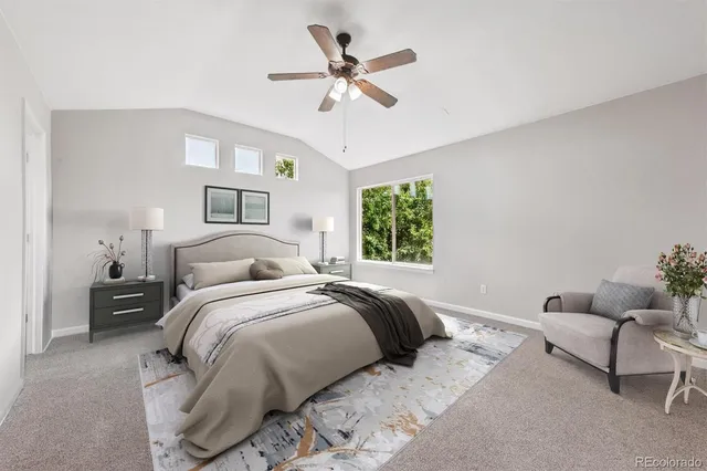 a bedroom with bed and a large window