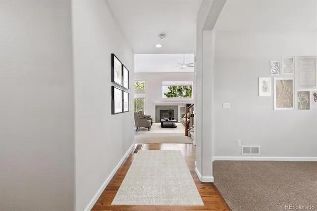 a room with a window wooden floor and a table