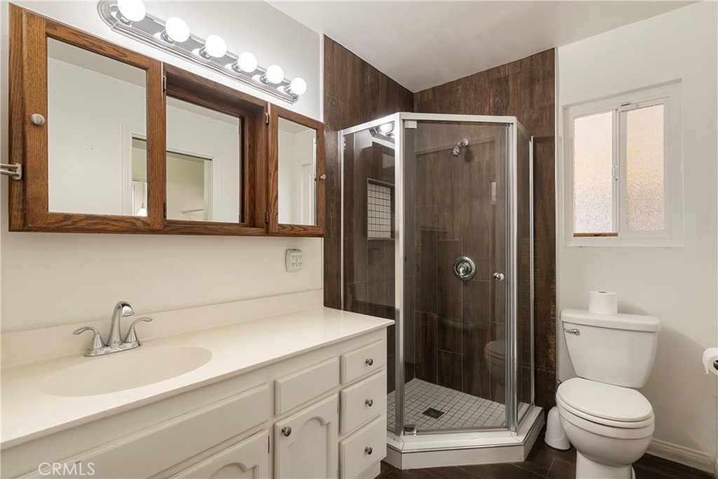 232 North Aspan Avenue Azusa, CA 91702 - Photo 13 of 29 a bathroom with a sink a toilet and shower