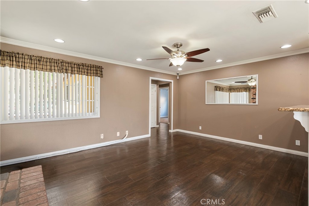 232 North Aspan Avenue Azusa, CA 91702 - Photo 14 of 29 a view of an empty room with window and wooden floor