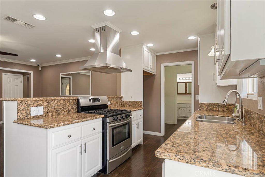 232 North Aspan Avenue Azusa, CA 91702 - Photo 19 of 29 a kitchen with granite countertop a sink stainless steel appliances and cabinets