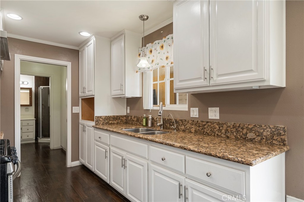 232 North Aspan Avenue Azusa, CA 91702 - Photo 20 of 29 a kitchen with granite countertop a sink and cabinets