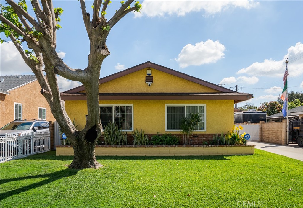 232 North Aspan Avenue Azusa, CA 91702 - Photo 2 of 29 a front view of a house with garden