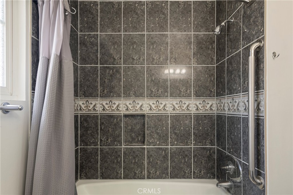 232 North Aspan Avenue Azusa, CA 91702 - Photo 6 of 29 a bathroom with a shower and a sink