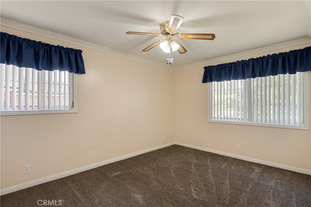 232 North Aspan Avenue Azusa, CA 91702 - Photo 7 of 29 an empty room with windows and fan