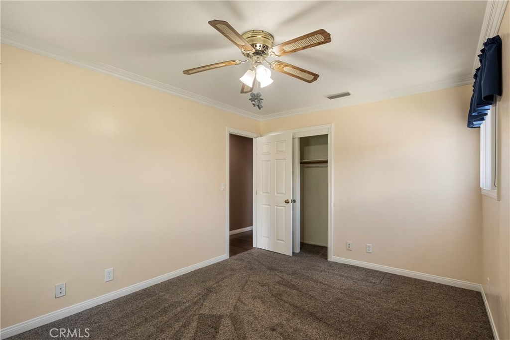 232 North Aspan Avenue Azusa, CA 91702 - Photo 8 of 29 a view of an empty room with a ceiling fan
