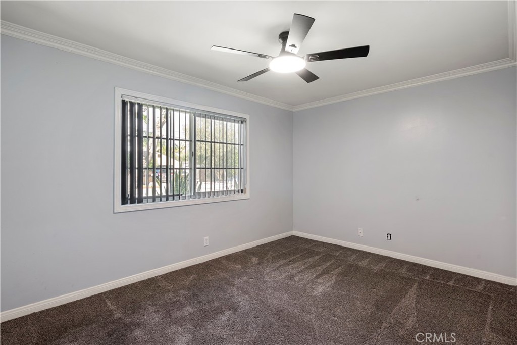 232 North Aspan Avenue Azusa, CA 91702 - Photo 9 of 29 an empty room with a window and a fan