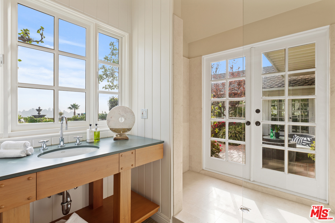 1110 Stradella Road Los Angeles, CA 90077 - Photo 11 of 28 a room with a large window and a table chair