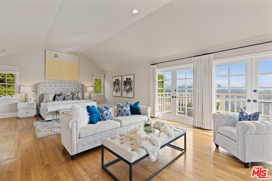 1110 Stradella Road Los Angeles, CA 90077 - Photo 12 of 28 a living room with furniture and a large window