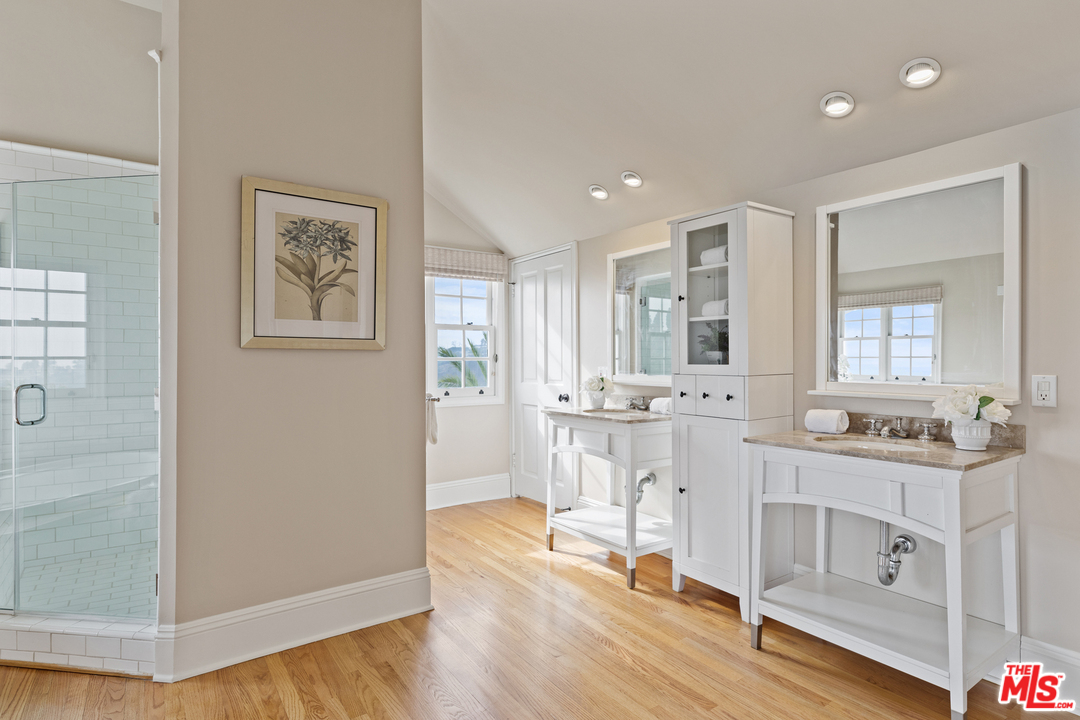 1110 Stradella Road Los Angeles, CA 90077 - Photo 15 of 28 a living room with furniture a wooden floor and white walls