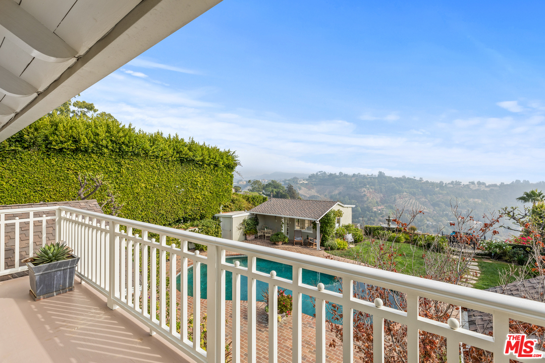 1110 Stradella Road Los Angeles, CA 90077 - Photo 17 of 28 a view of a city from a balcony