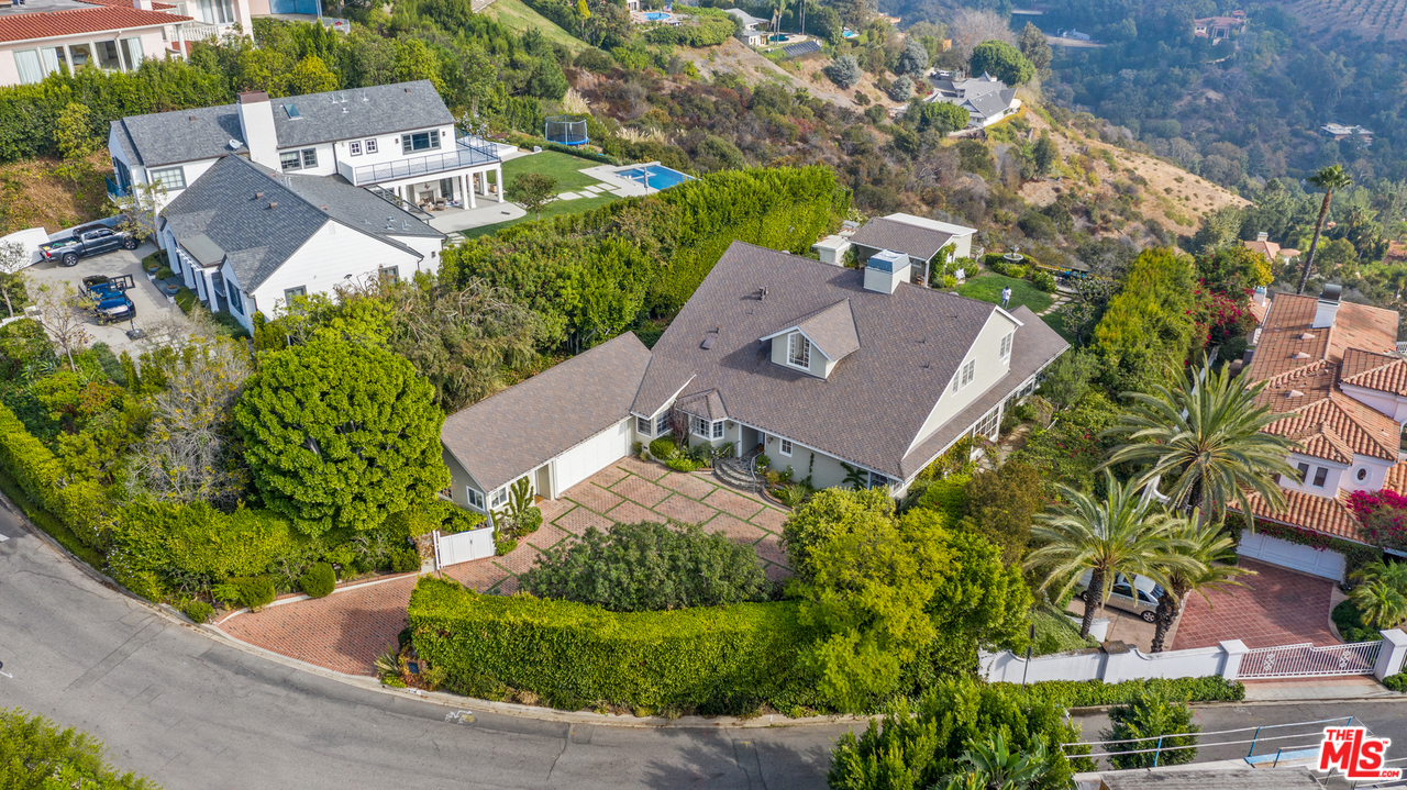 1110 Stradella Road Los Angeles, CA 90077 - Photo 28 of 28 an aerial view of a house with a garden and trees