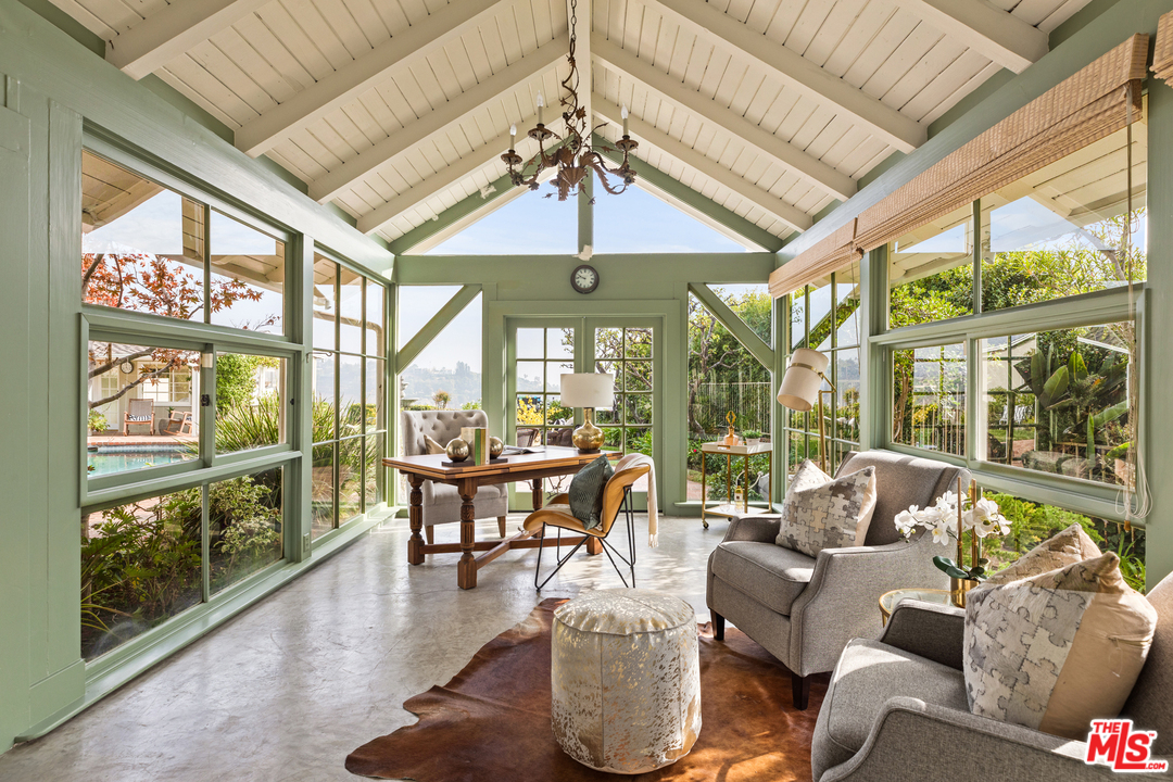 1110 Stradella Road Los Angeles, CA 90077 - Photo 6 of 28 a living room with furniture and a large window