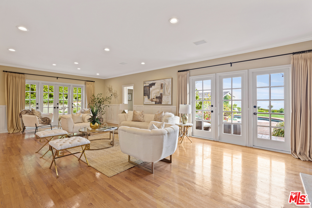 1110 Stradella Road Los Angeles, CA 90077 - Photo 7 of 28 a living room with fireplace furniture and a large window