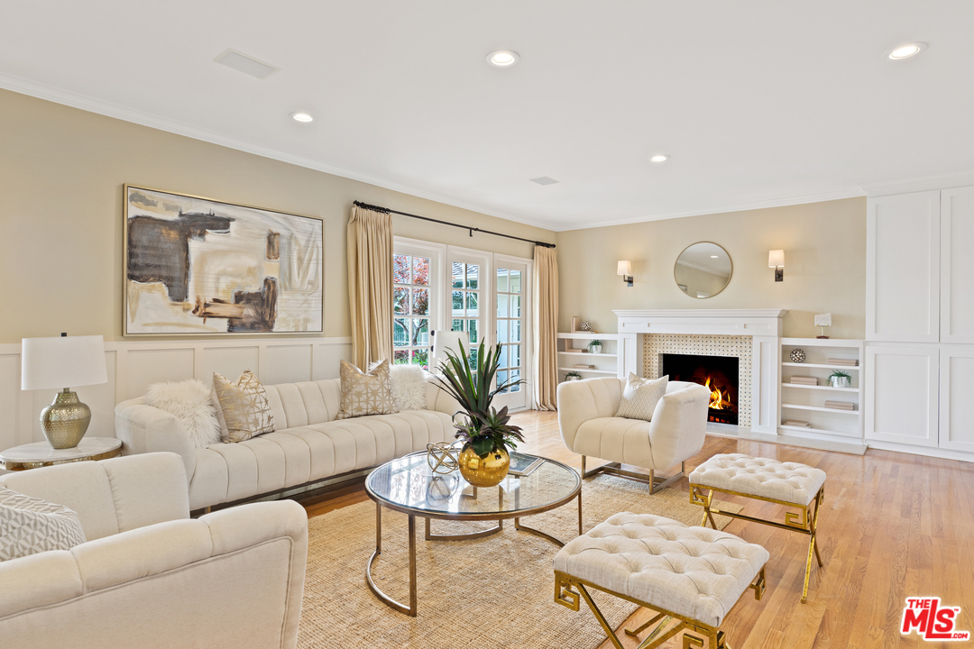 1110 Stradella Road Los Angeles, CA 90077 - Photo 8 of 28 a living room with furniture flower pot and a fireplace