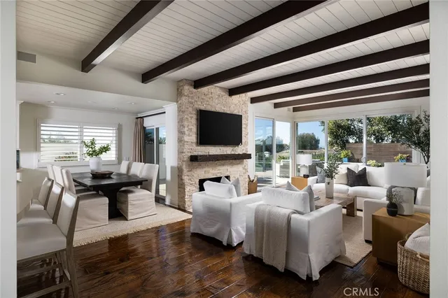 a living room with furniture fireplace and a flat screen tv