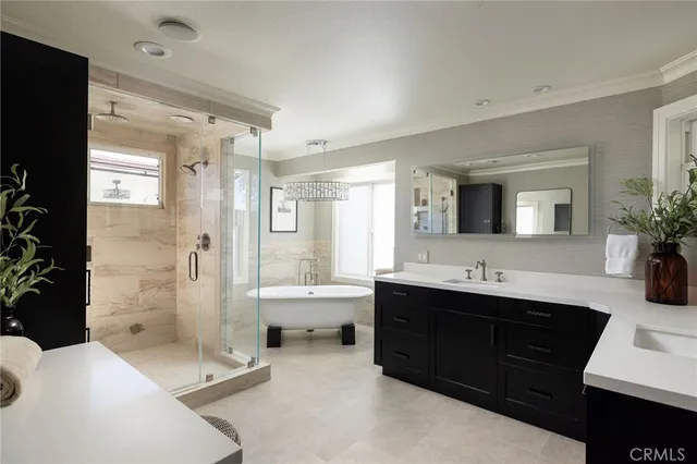 a bathroom with a double vanity sink mirror and shower