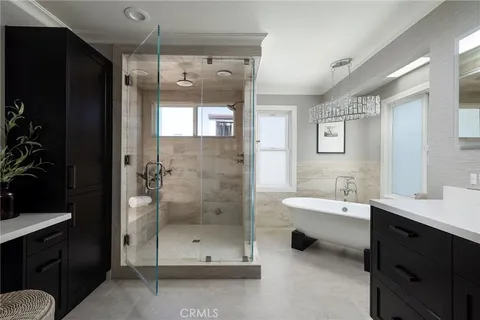 a bathroom with a double vanity sink and mirror