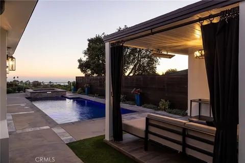 a view of swimming pool with patio