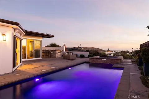 a terrace with outdoor seating and city view