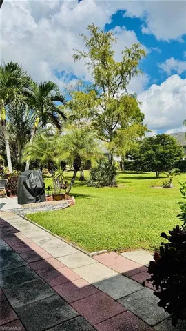 a view of a garden with ocean