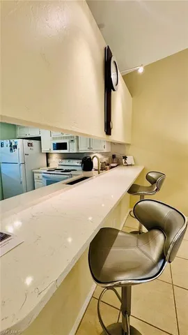 a kitchen with counter top space and appliances