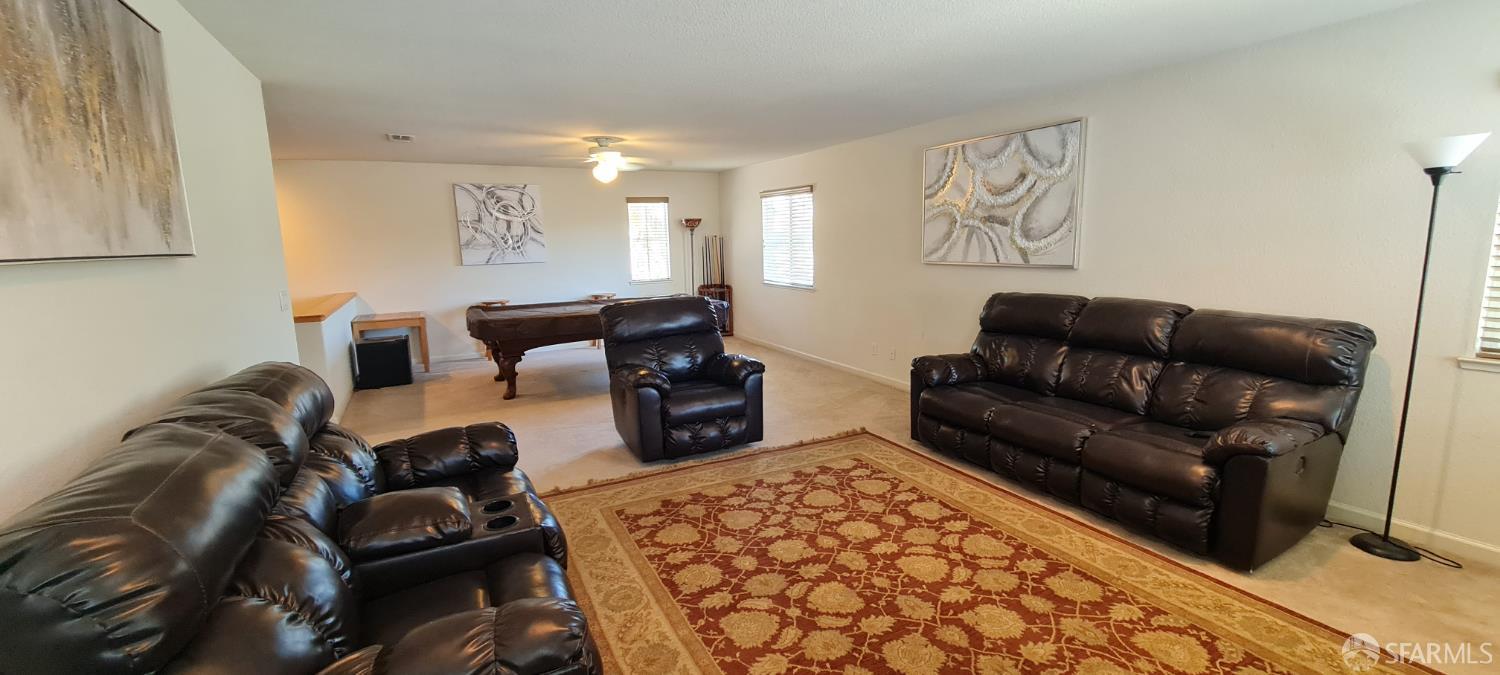 716 Seminole Court Discovery Bay, CA 94505 - Photo 18 of 21 a living room with furniture and a rug