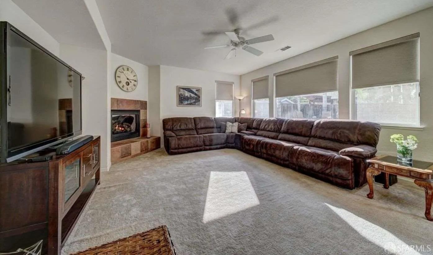 716 Seminole Court Discovery Bay, CA 94505 - Photo 5 of 21 a living room with furniture and a flat screen tv