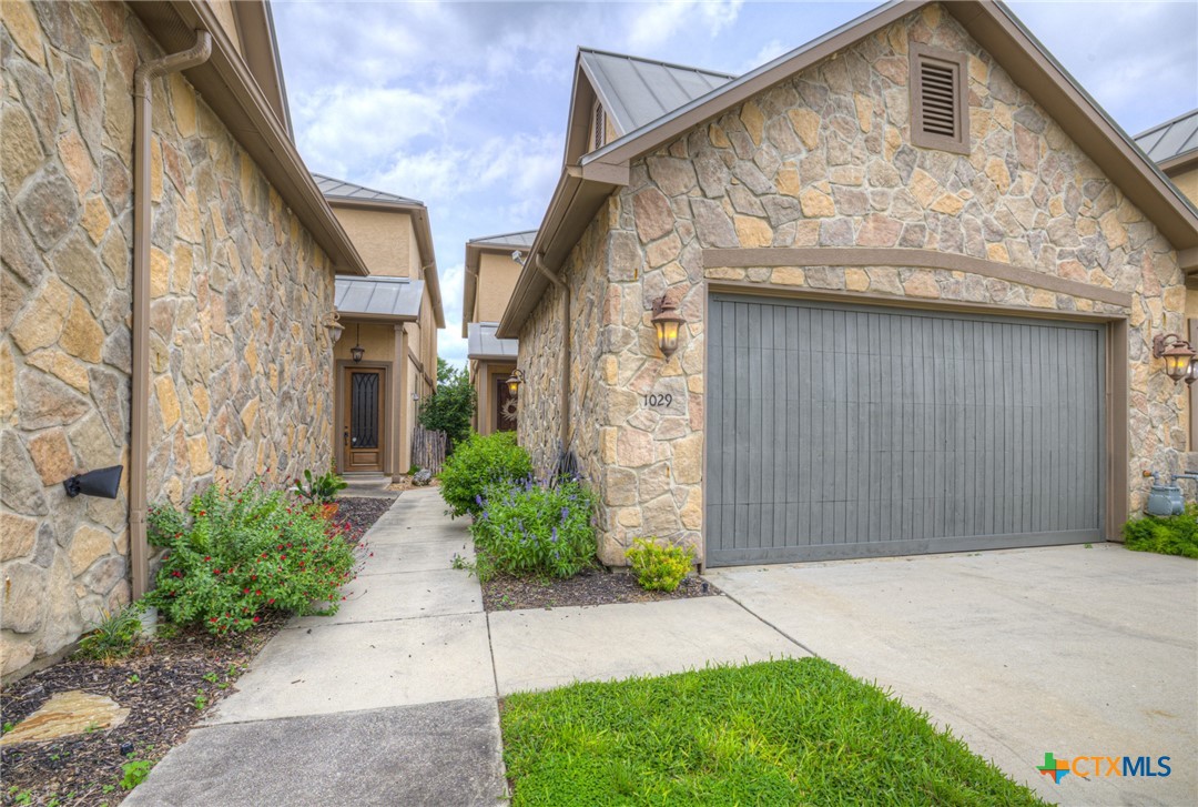 1029 Gruene Road New Braunfels, TX 78130 - Photo 3 of 48 a front view of a house with a garden