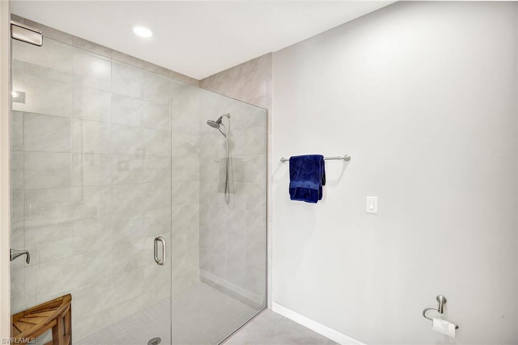 14863 Edgewater Circle Naples, FL 34114 - Photo 13 of 35 a bathroom with a shower