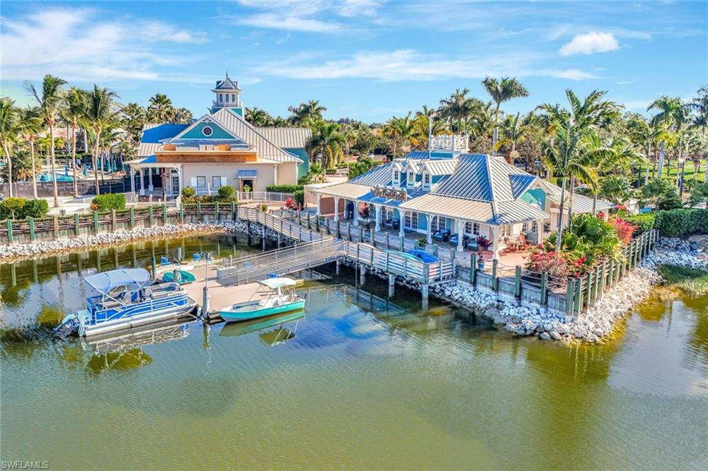 14863 Edgewater Circle Naples, FL 34114 - Photo 27 of 35 a view of a lake with houses