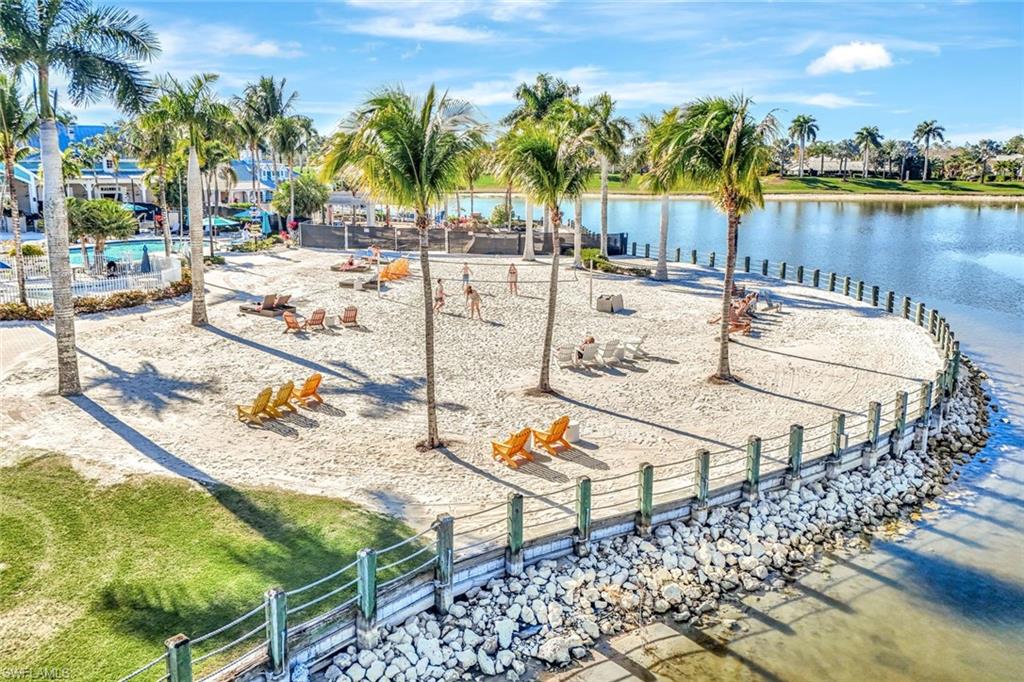 14863 Edgewater Circle Naples, FL 34114 - Photo 30 of 35 a view of swimming pool with outdoor seating and plants