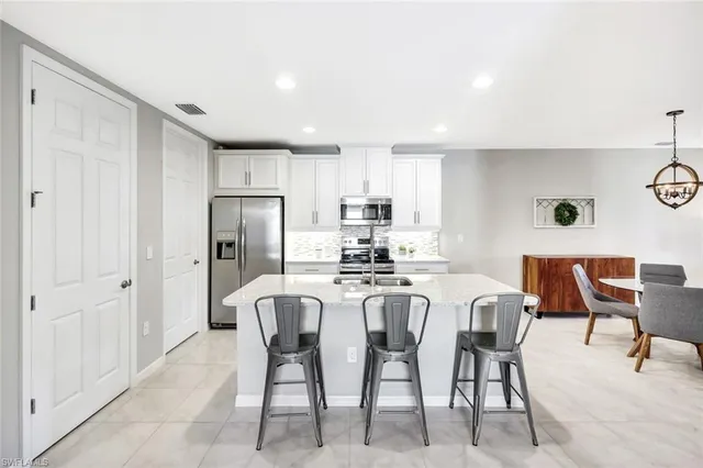 $469,900 | 14863 Edgewater Circle, Naples, FL 34114