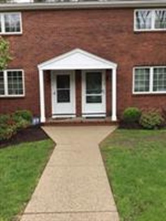 63 Linden Street, Unit 7 Wellesley, MA 02482 - Photo 2 of 11 a front view of a house with garden